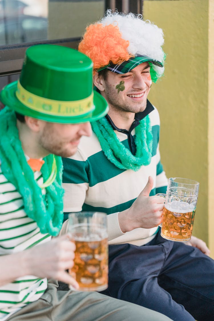 Smiling Men Drinking Beer And Celebrating St. Patricks Day