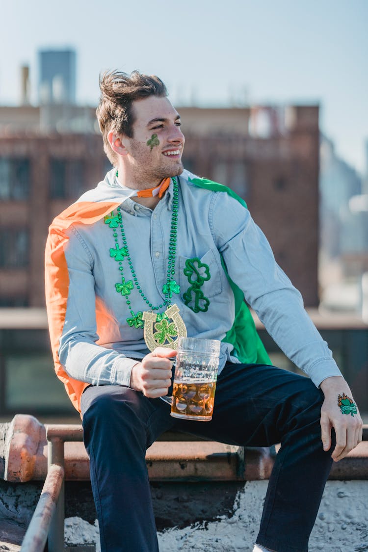 Content Guy Boozing Beer And Smiling During Celebration Of St Patricks Day