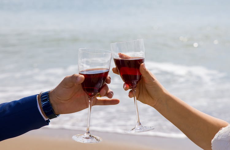 Couple Toasting A Glass Of Wine