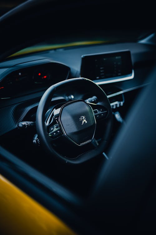 Free Luxurious Black Car Steering Wheel Stock Photo