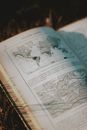 Old book with map illustration in sunlight