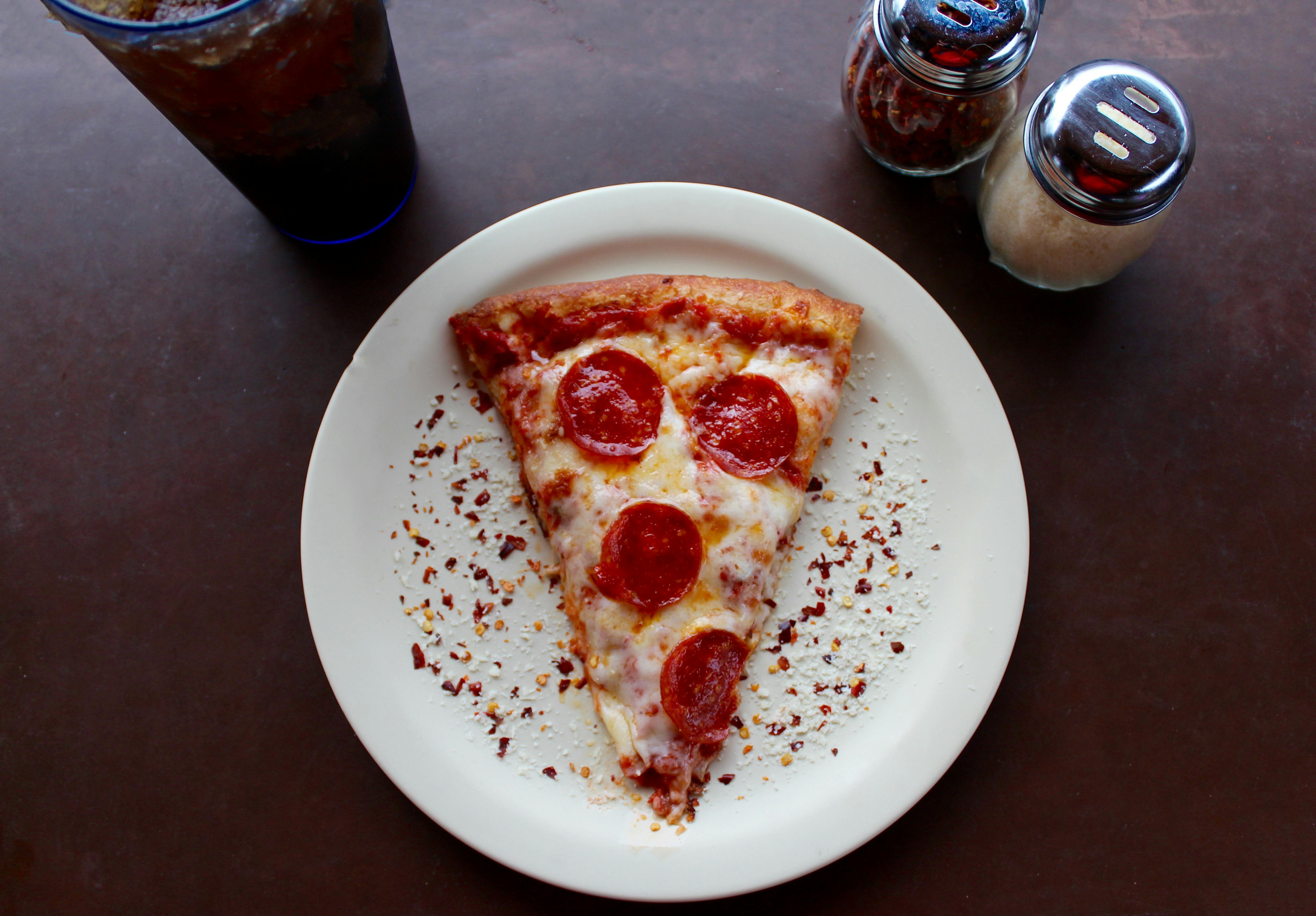 Sliced Pepperoni Pizza on White Ceramic Plate · Free Stock Photo