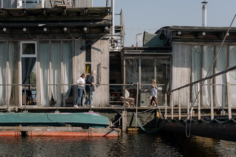 People On Harbor By The River 