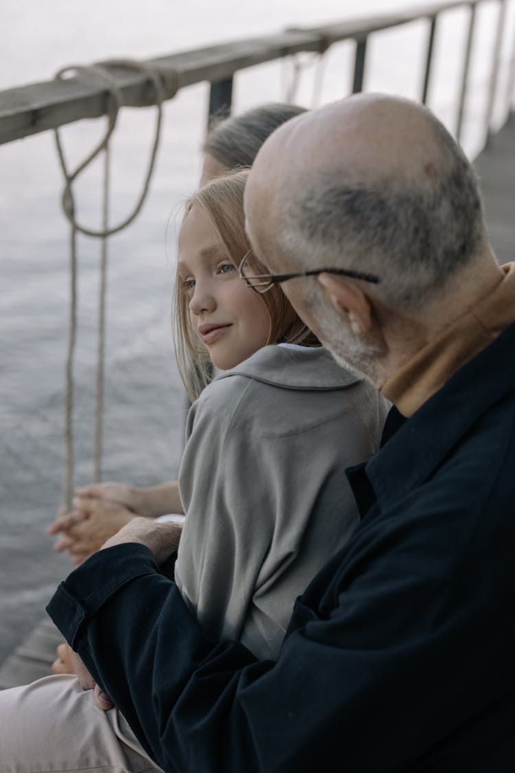 A Grandfather And Young Girl Talking Together