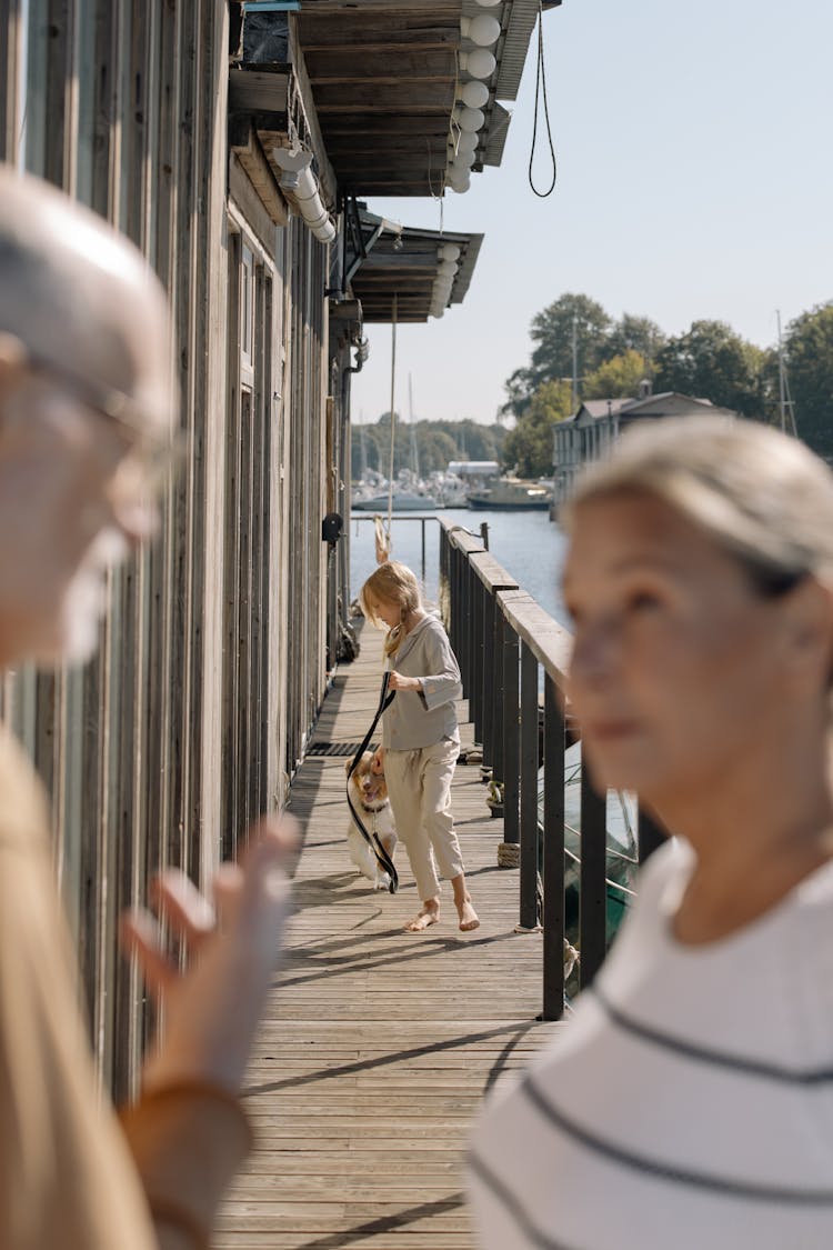 A Girl Walking Her Pet Dog 