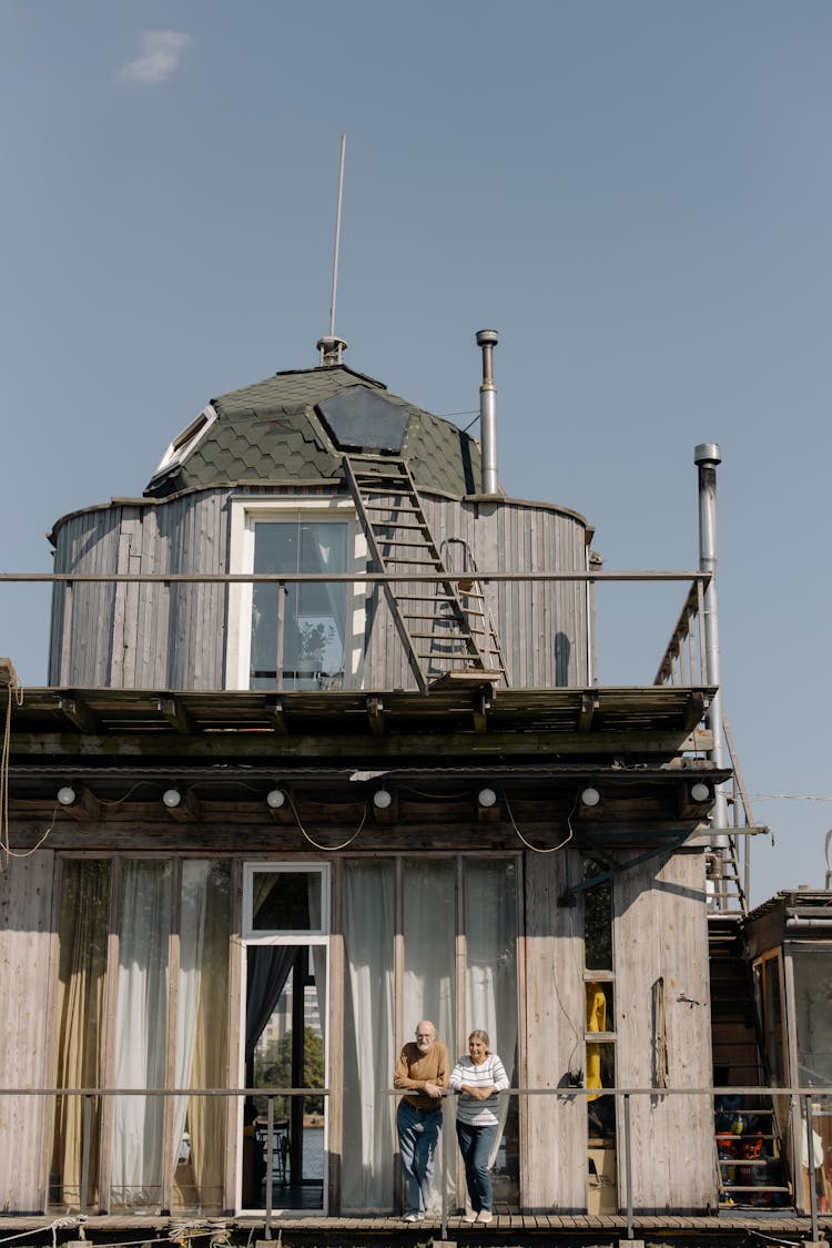 Elderly Couple Outside Their Houseboat