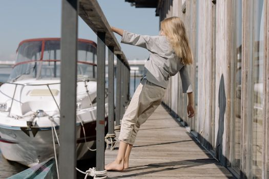 Girl Hanging on Railing