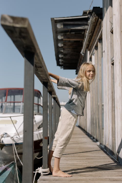 A Young Girl Standing in Balcony