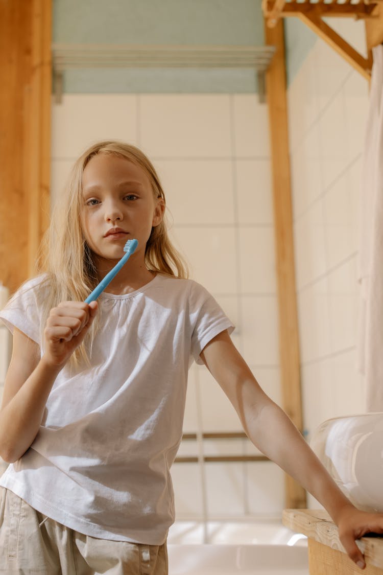 A Girl Holding Her Toothbrush