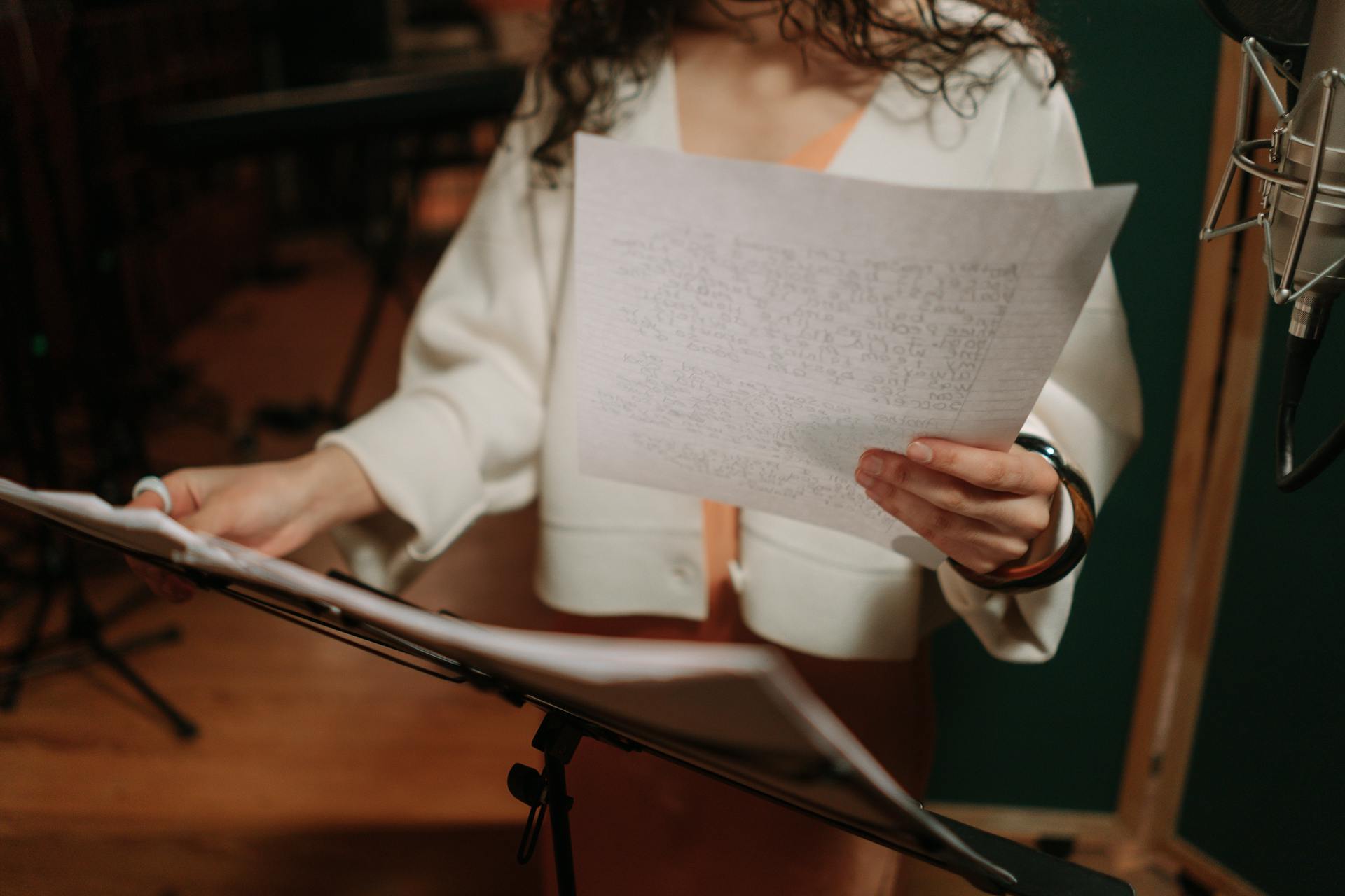 Close-Up Shot of an Artist Holding a Paper