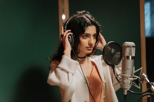 A Beautiful Female Artist Recording a Song