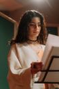 Pretty Female Artist Reading the Lyrics of the Song