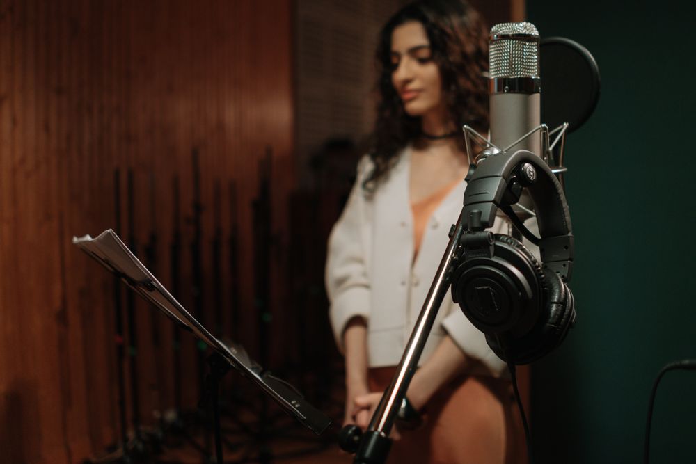 A narrator recording a chapter in a home studio. Photo by cottonbro studio on Pexels