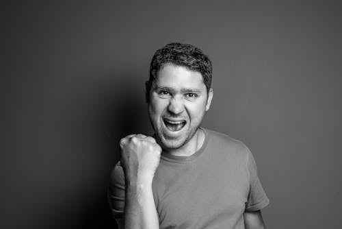 Monochrome Shot of a Man Looking Excited