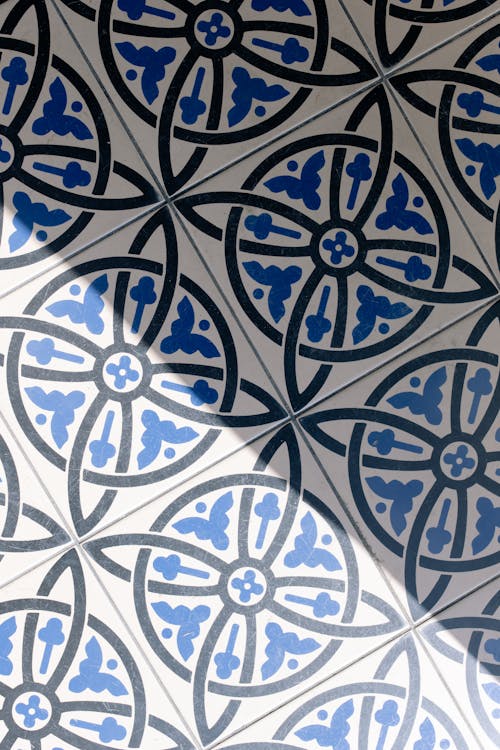 Blue and Black Floral Design on White Tiles