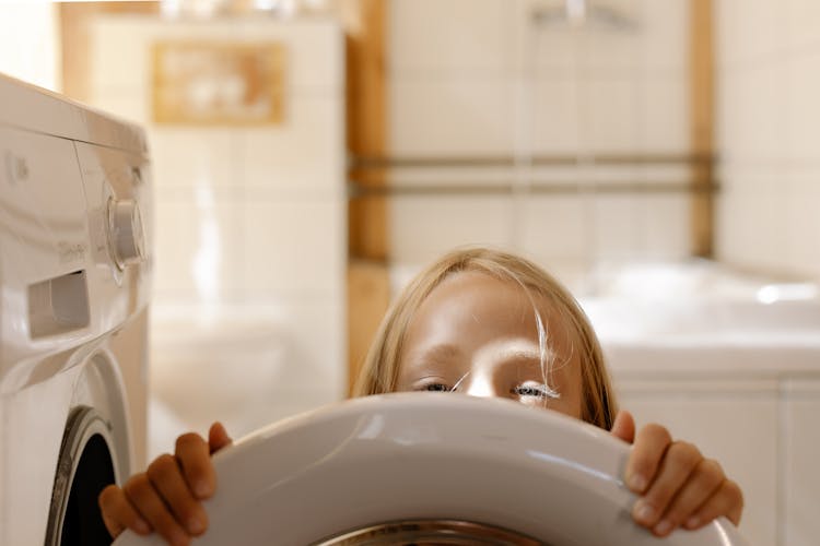 Headshot Of A Girl Doing The Laundry