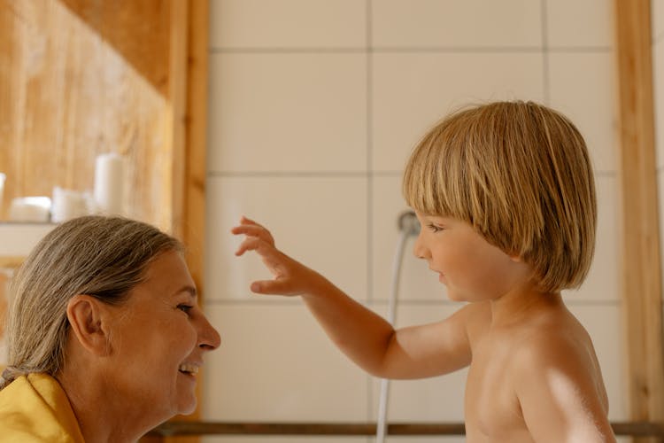 Grandmother Bathing His Grandson