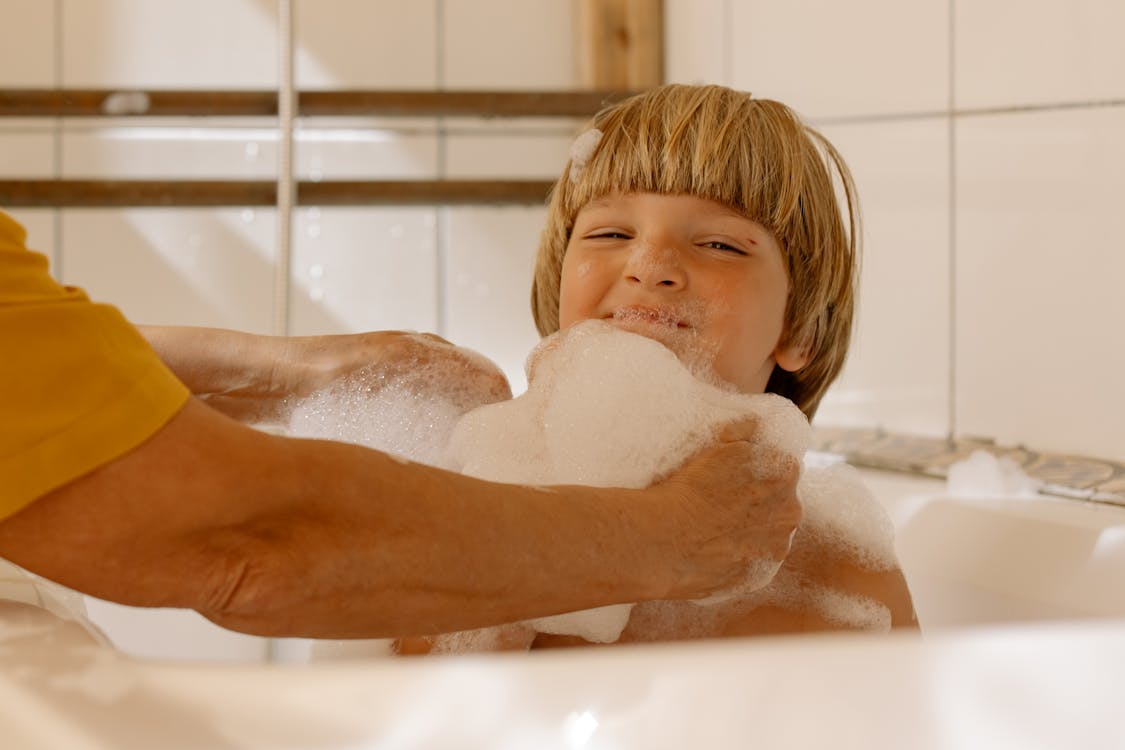 Blonde Haired Girl in Bathtub