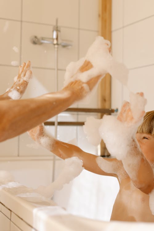 A Boy Taking a Bath