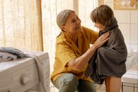 A Grandmother Drying His Grandson with Towel