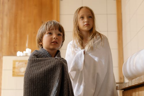 Free Two Kids Covered with Towels  Stock Photo