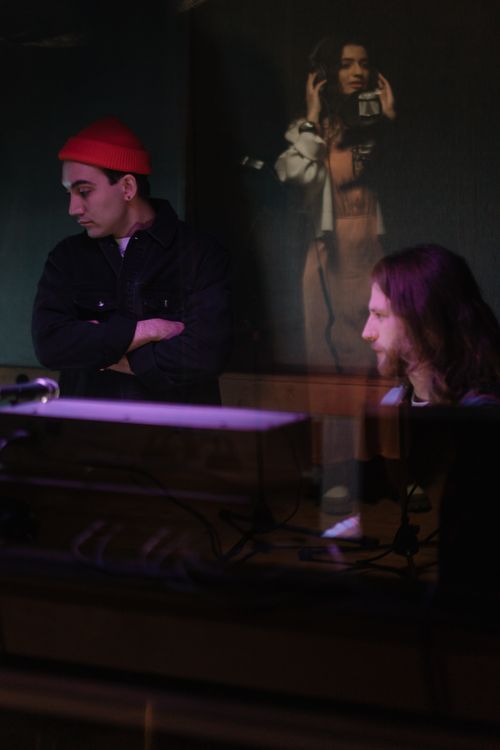 Free Vibrant musicians collaborating in a modern music studio, producing and recording tracks. Stock Photo