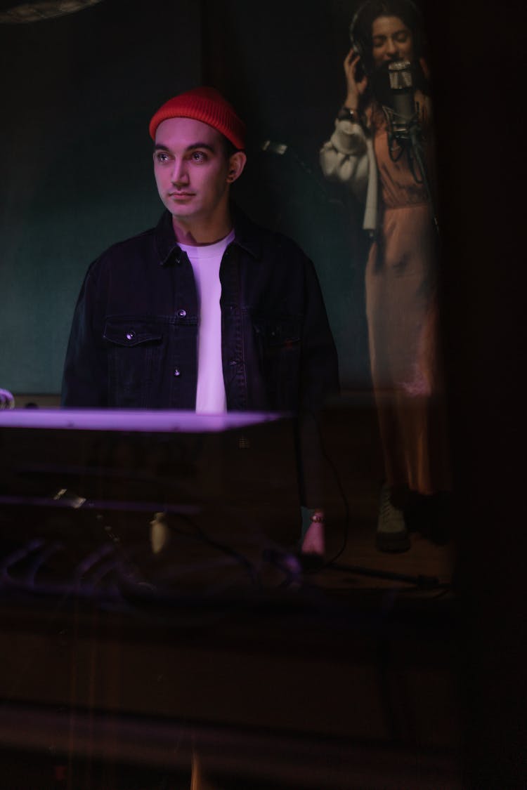 Man In Hat And Jean Shirt In Darkness