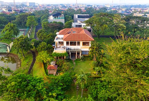 Drone shot of a lush residence in Tangerang, surrounded by greenery.