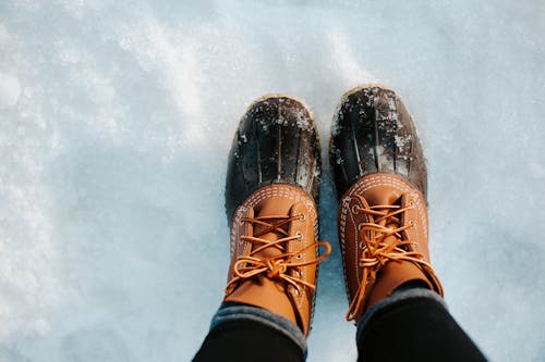 A Person Wearing Brown Hiking Shoes