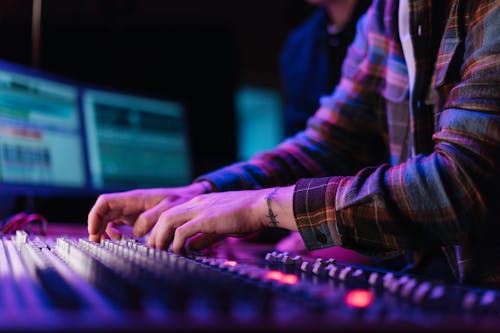 Close-Up Shot of a Person Using an Audio Equipment