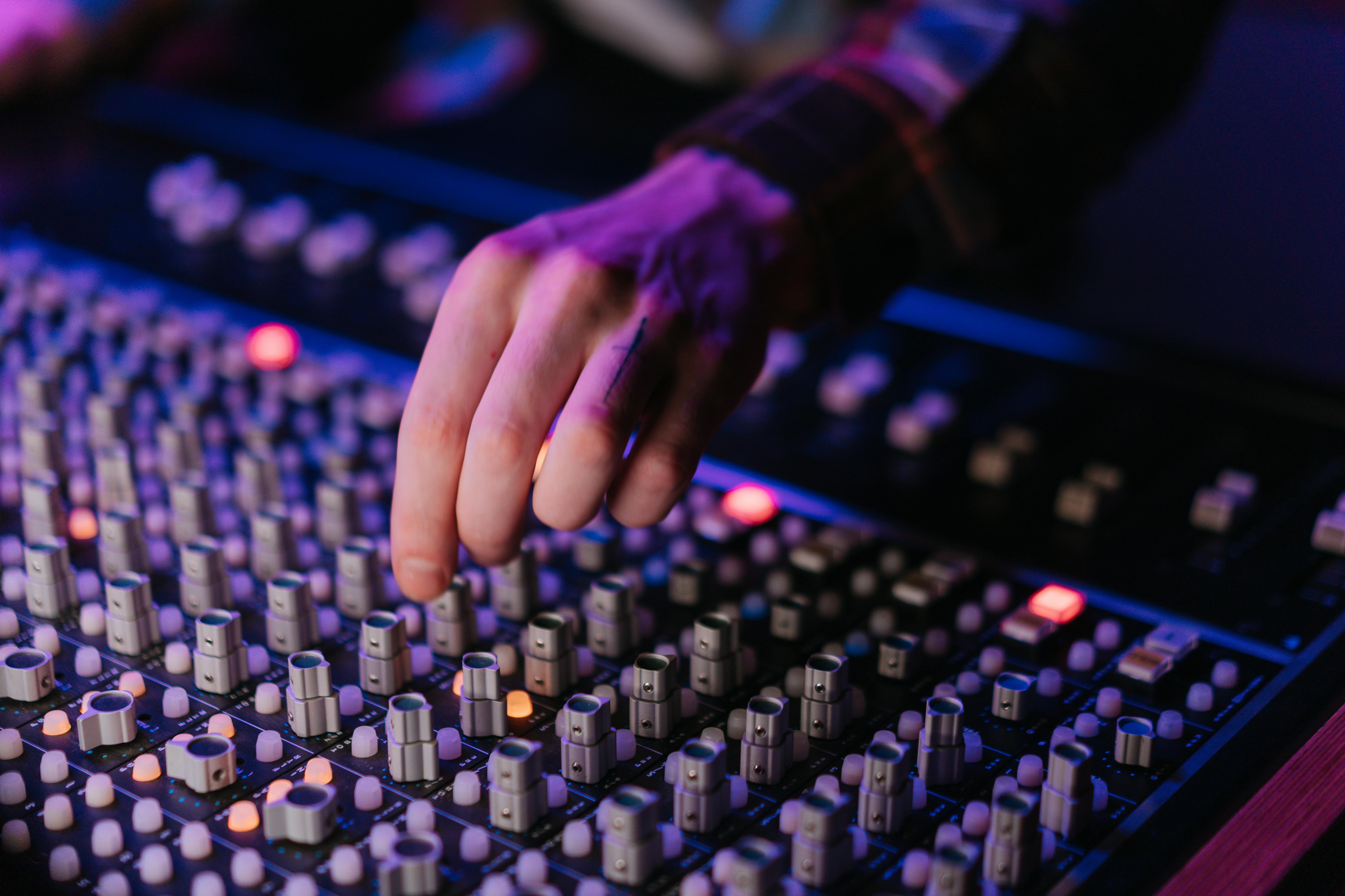 Female Engineer Controlling Lights · Free Stock Photo