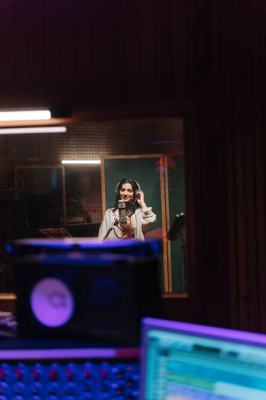 Singer recording vocals in a studio