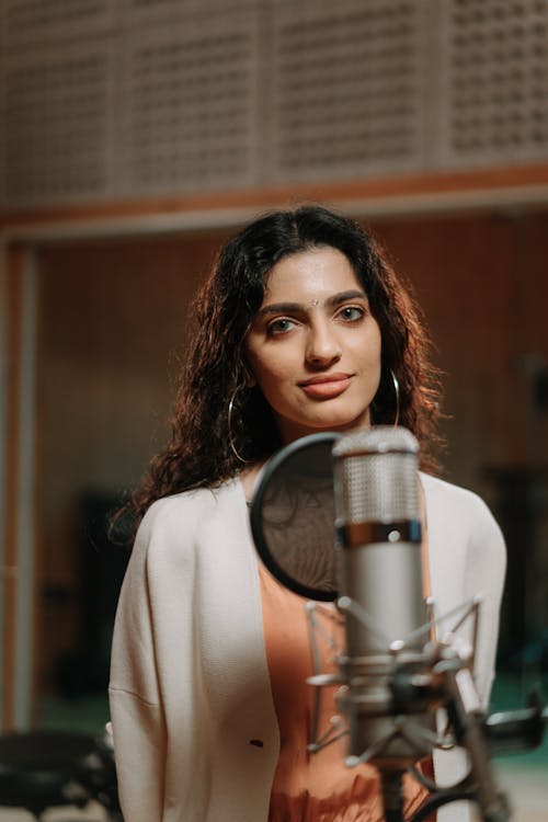 A Beautiful Singer Recording a Music