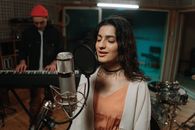 A Woman Singing with Her Eyes Closed