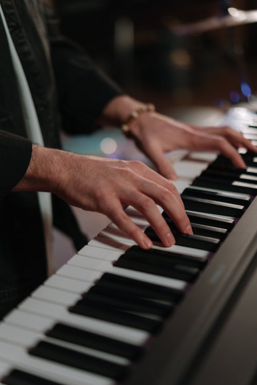 Free Close-Up Shot of a Person Playing Piano Stock Photo