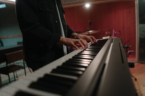 Person Playing Keyboard