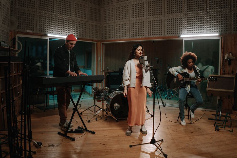 Band rehearsing in a recording studio