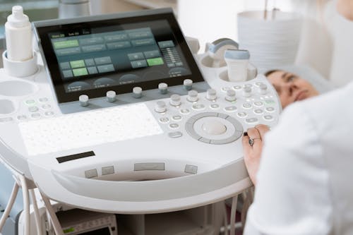 Free Photo Of Person Using Ultrasound Scan Stock Photo