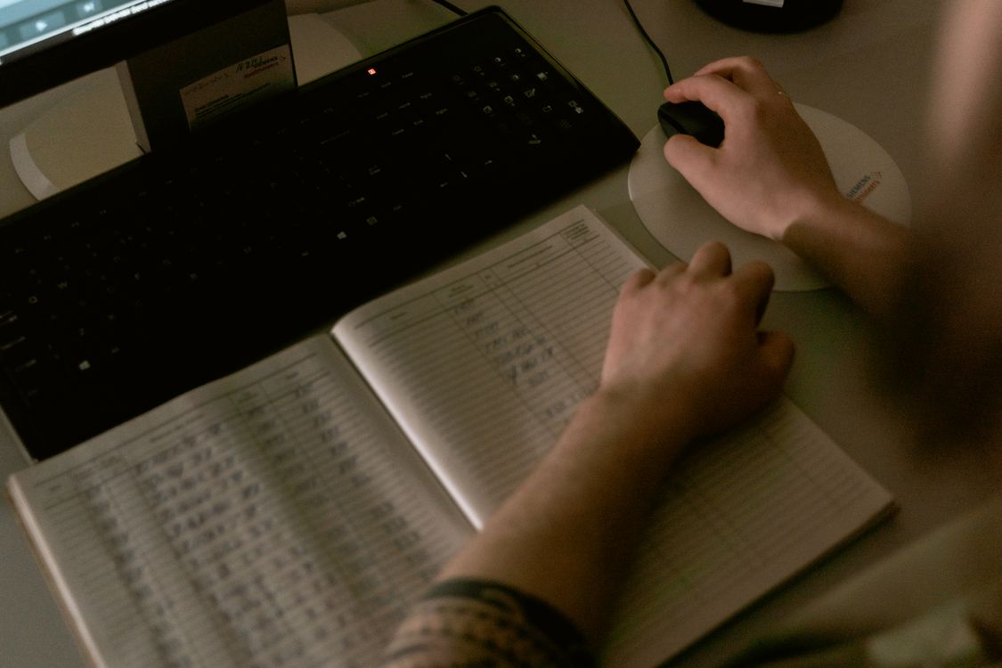 Healthcare professional reviewing digital patient information on a computer