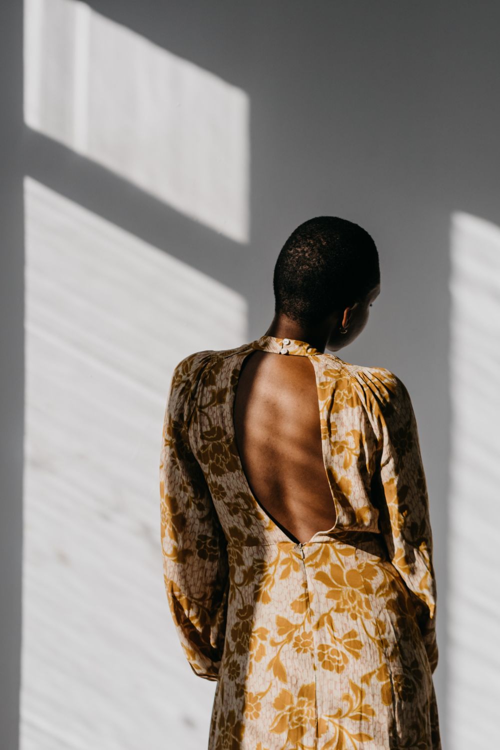 A Woman in Gold Floral Dress · Free Stock Photo