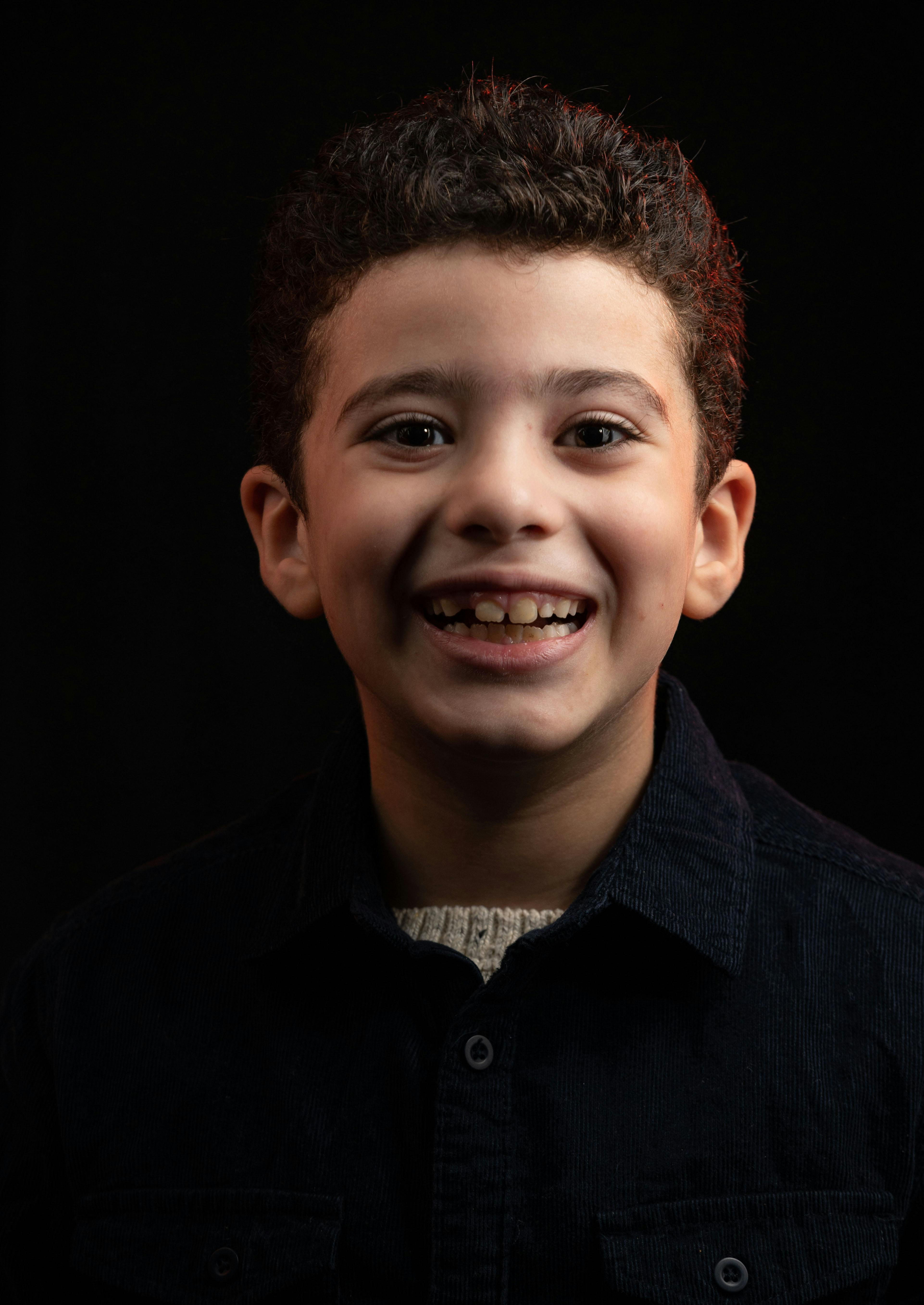 Boy in Black Button Up Shirt Smiling · Free Stock Photo