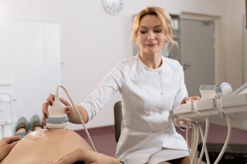 Photo Of Gynecologist Doing An Ultrasound Test