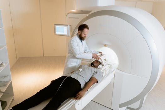 A doctor assists a patient during an MRI scan in a medical facility.