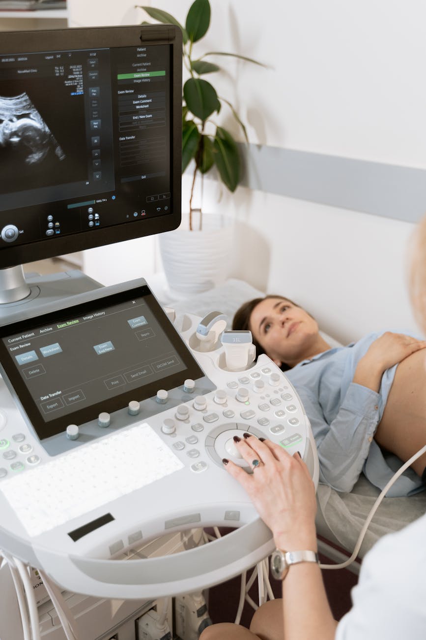 Photo Of OB-GYN Doing A Test · Free Stock Photo