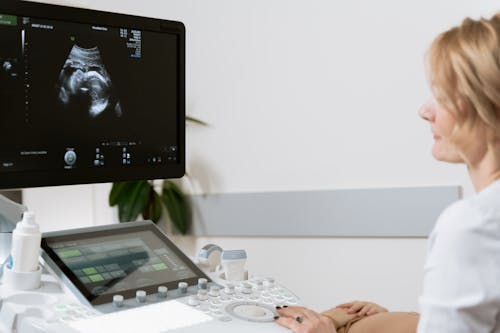 Photo Of Person Using Ultrasound Scan