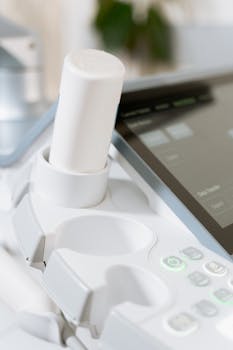Detailed view of an ultrasound scanner in a healthcare setting.