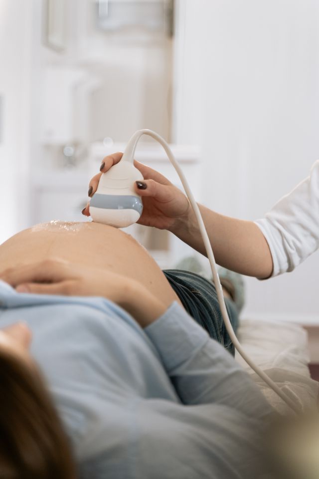 Woman receiving an ultrasound examination at a fertility clinic
