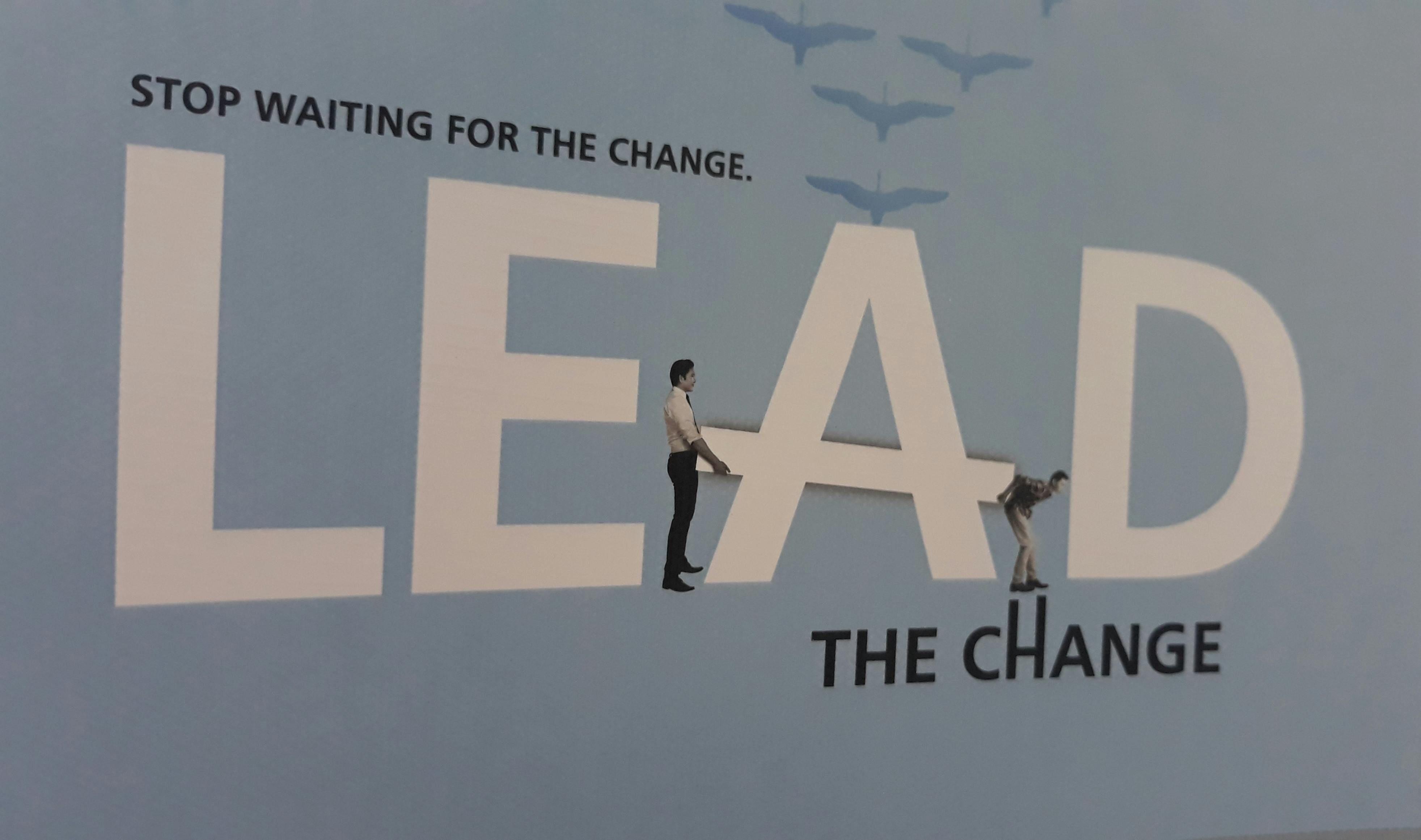 Parent gently holding a newborn baby's hand in a hospital