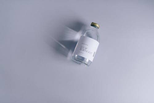 Close-Up Shot of a Bottle of Liquid