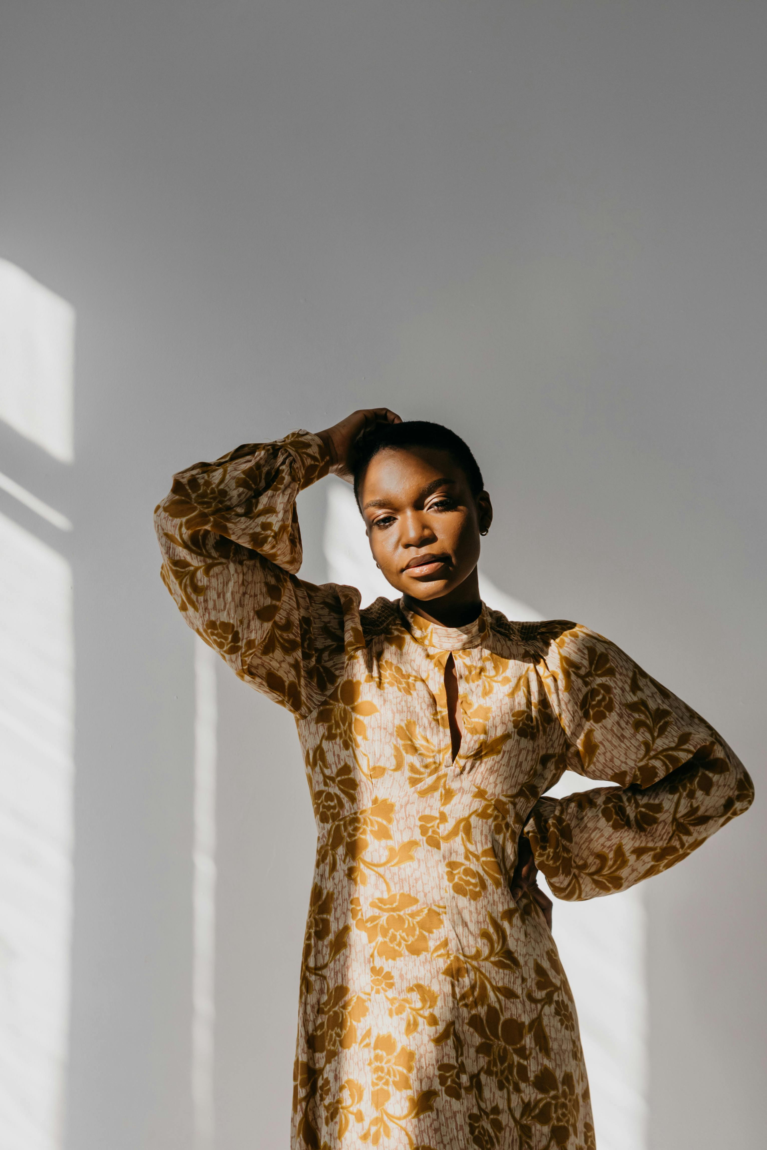 Woman in Golden Glamour Dress in Studio · Free Stock Photo